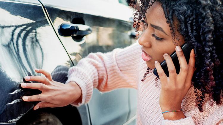 A woman is on the phone with her State Farm agent